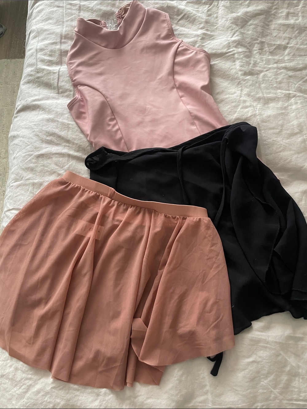 Blush Pink Sleeveless Bodysuit with Black Wrap Skirt and Dusty Rose Skirt